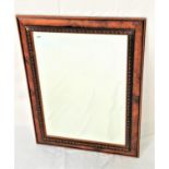 FAUX WALNUT WALL MIRROR with a rectangular bevelled plate, 64.5cm x 49cm