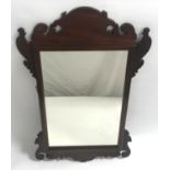 GEORGIAN STYLE MAHOGANY FRET CARVED WALL MIRROR with an oblong plate, 74cm high