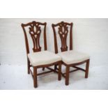 PAIR OF CHIPPENDALE STYLE MAHOGANY DINING CHAIRS with shaped top rails above a carved and pierced
