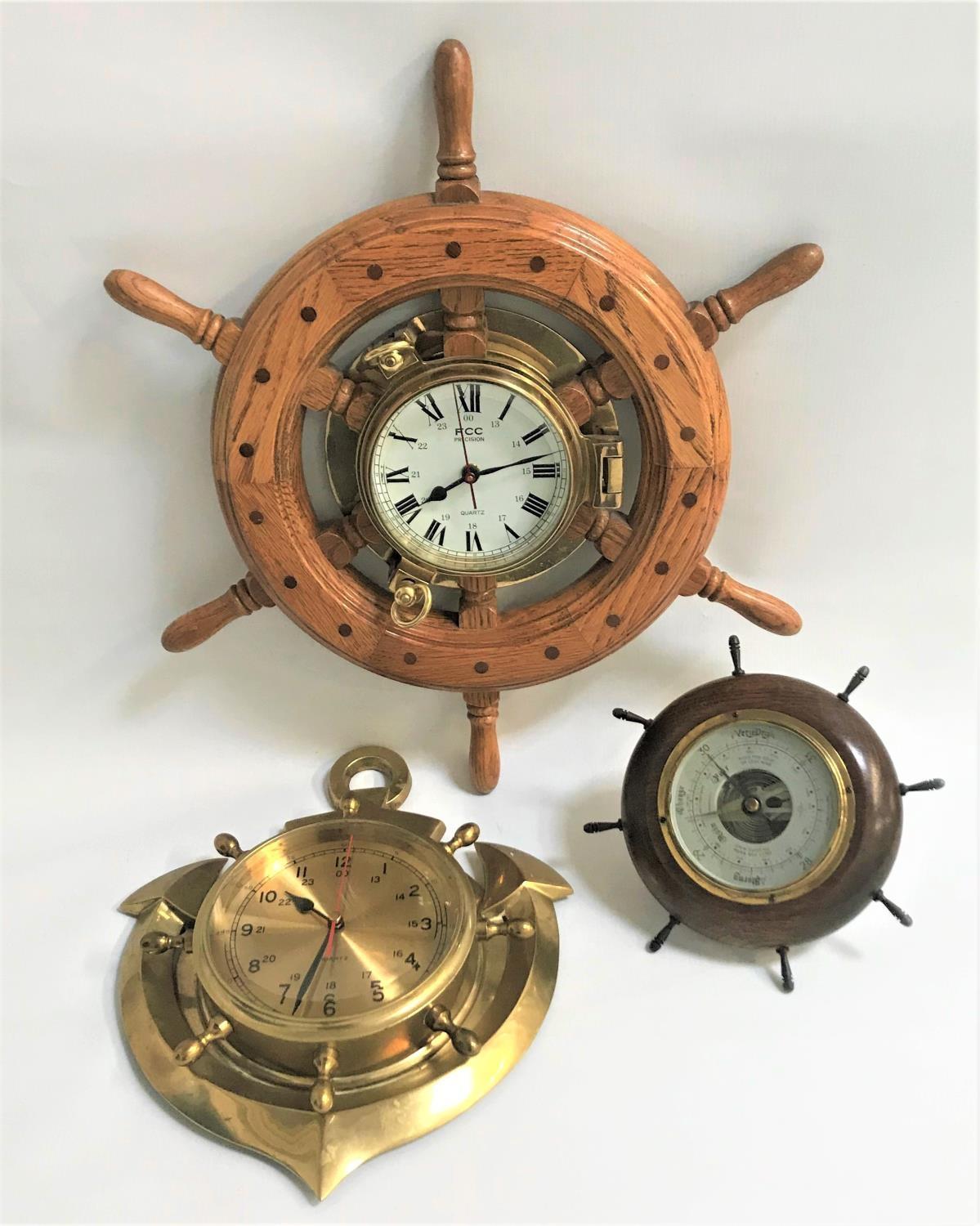 TWO NAUTICAL THEMED WALL CLOCKS AND A SIMILAR BAROMETER one clock by FCC Precision with circular