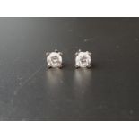 PAIR OF DIAMOND STUD EARRINGS the round brilliant cut diamonds totaling approximately 0.7cts, in