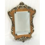 SHAPED SILVER AND GILTWOOD WALL MIRROR with a rectangular bevelled plate, 107cm high