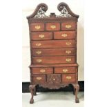 FEDERAL STYLE MAHOGANY CHEST ON STAND with a swan neck pierced bonnet top pediment above a pierced