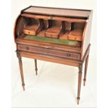 YEW CYLINDER DESK with a fitted interior and pull out leather inset shelf above a frieze drawer,