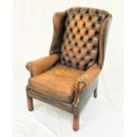 CHESTERFIELD WING BACK ARMCHAIR in mustard leather with decorative stud detail, standing on front