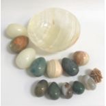 SELECTION OF POLISHED STONE EGGS of various sizes and colour, together with a polished stone bowl