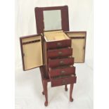 STAINED JEWELLERY CABINET with a lift up mirrored lid revealing a fitted interior above four drawers