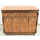 DREXEL PECAN/WALNUT SIDE CABINET with a two section fold out top above two frieze drawers with two