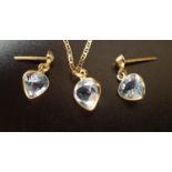 BLUE TOPAZ SUITE OF JEWELLERY comprising a pair of earrings and a pendant, all with heart cut blue