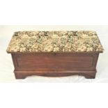 LANE OF VIRGINIA OAK BLANKET BOX with an upholstered lift up lid above a carved panel front, 102cm