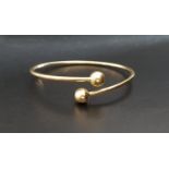 TIFFANY & CO. EIGHTEEN CARAT GOLD HARDWEAR BALL BYPASS BRACELET the twist design bracelet with