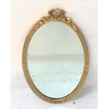 GILT FRAME OVAL WALL MIRROR with laurel leaf decoration, 71.5cm high