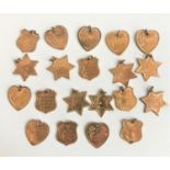 SELECTION OF BRASS PENDANTS comprising seven stars, seven hearts and six shield shape pendants