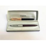 TWO PARKER 51 FOUNTAIN PENS one with a maroon body and steel lid, the other a black body and a