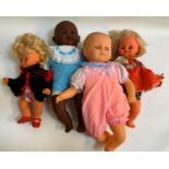FOUR PLASTIC DOLLS comprising a Hong Kong doll with open and sleeping eyes, dressed in a pink baby