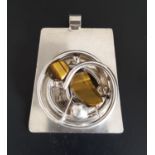 UNUSUAL HEAVY SILVER DANISH PENDANT the trapezoid plaque set with tiger's eye in spiral and ball