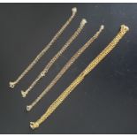 FOUR NINE CARAT GOLD NECK CHAINS one heavier example 55cm long and approximately 3.8 grams; together