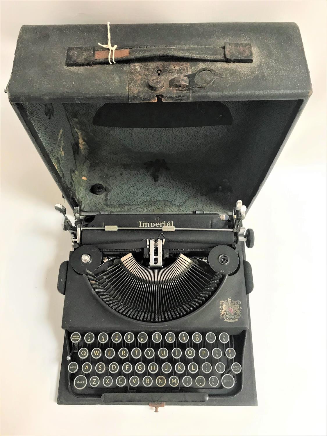 PORTABLE IMPERIAL TYPEWRITER in a hard shell case with carry handle