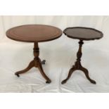 MAHOGANY CIRCULAR OCCASIONAL TABLE with an inset leather top raised on a shaped column with three