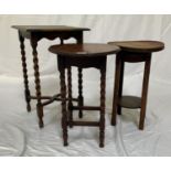 OAK OCCASIONAL TABLE with a circular top above a swing out cup holder, standing on shaped supports