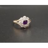 PRETTY DIAMOND AND AMETHYST CLUSTER RING the central round cut amethyst in eight diamond surround,