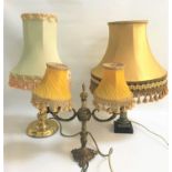 GILT METAL TABLE LAMP with twin shaped arms and central finial, with a pleated yellow shades, 37.5cm