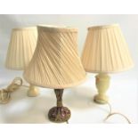 PAIR OF ALABASTER TABLE LAMPS with stout shaped columns and pleated cream shades, 39cm high,