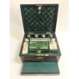 EARLY VICTORIAN BRASS BOUND ROSEWOOD TRAVELLING VANITY CASE the interior cover with drop flap
