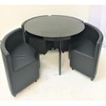 DWELL ROTUNDA STYLE BLACK LACQUER CIRCULAR DINING TABLE AND CHAIRS the table standing on four