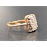 DIAMOND CLUSTER RING the twelve small diamonds in rectangular setting, in palladium and gold (
