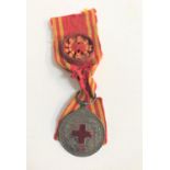 CHINESE RED CROSS SPECIAL MEMBER MEDAL centered with an enamel red cross framed by leaves, the