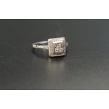 DIAMOND CLUSTER RING in eighteen carat white gold with square setting, the diamonds totalling