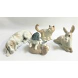 FOUR LLADRO AND NAO ANIMAL ORNAMENTS comprising a Lladro reclining dog, a Lladro fawn, a Nao cat and