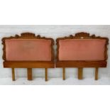 PAIR OF PINE SINGLE BED HEADBOARDS with shaped carved tops and sides and a pink draylon padded