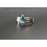 BLUE TOPAZ SINGLE STONE RING the marquise cut topaz flanked by decorative triple ridged shoulders,