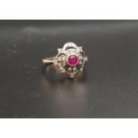 RUBY AND DIAMOND CLUSTER RING the central round cut ruby in pierced multi diamond set surround, on