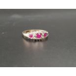 RUBY AND DIAMOND RING the three graduated rubies with small diamonds between, on nine carat gold