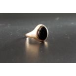BLACK AGATE SET SIGNET RING on nine carat gold shank, ring size H-I