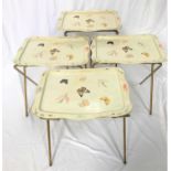 SET OF THREE 1950'S METAL FOLDING TRAYS each with a shaped top decorated with butterflies and leaves