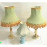 PAIR OF ALABASTER TABLE LAMPS raised on circular bases with a gilt metal column and blue and gold