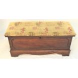 LANE OF VIRGINIA OAK BLANKET BOX with an upholstered padded lift up lid above a carved panel