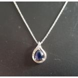 SAPPHIRE AND DIAMOND PENDANT the pear cut sapphire with small diamonds to the nine carat white