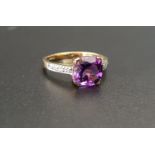 AMETHYST AND DIAMOND RING the central cushion cut amethyst approximately 1.8cts flanked by diamond