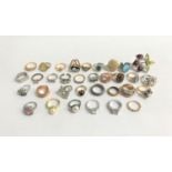 SELECTION OF COSTUME JEWELLERY RINGS of various sizes and designs including enamel and CZ