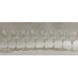 SET OF EIGHT CRYSTAL LIQUEUR GLASSES with thistle shaped bowls, shaped stems and circular foot, 11cm