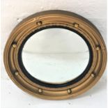 CIRCULAR GILT FRAME WALL MIRROR with applied ball decoration around the convex plate, 42.5cm