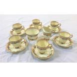 PLANT TUSCAN CHINA COFFEE SET with floral and gilt decoration on a cream ground, comprising six cups