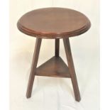 MAHOGANY OCCASIONAL TABLE with a circular top, standing on three plain supports united by a