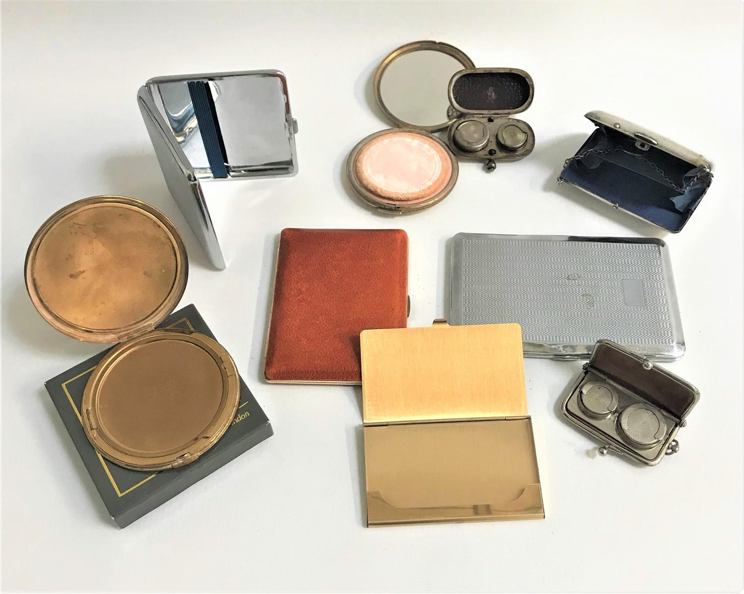 SELECTION OF COMPACTS including a boxed circular brass Vogue compact, circular brass compact with an