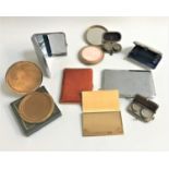 SELECTION OF COMPACTS including a boxed circular brass Vogue compact, circular brass compact with an